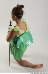 KATERINA KNNELING POSE WITH SWORD